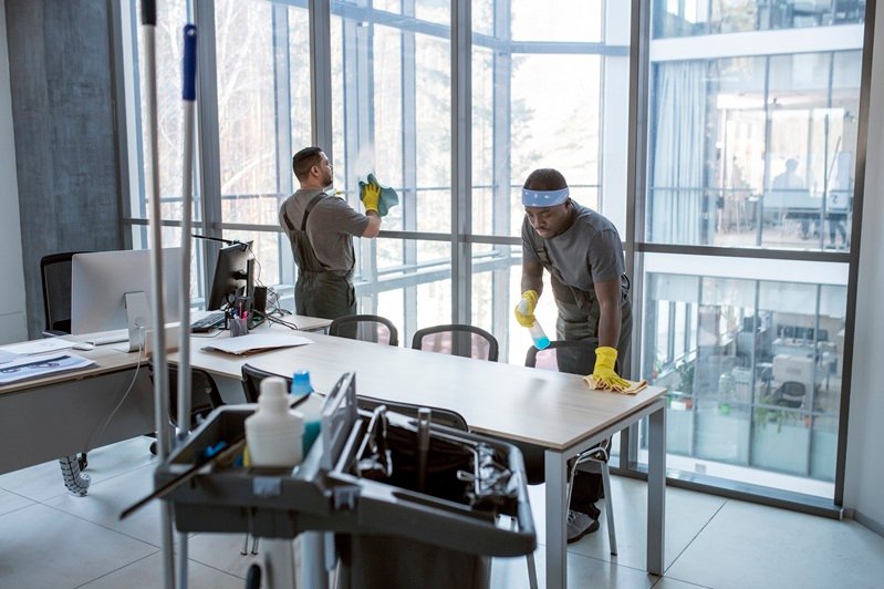 full shot men cleaning office